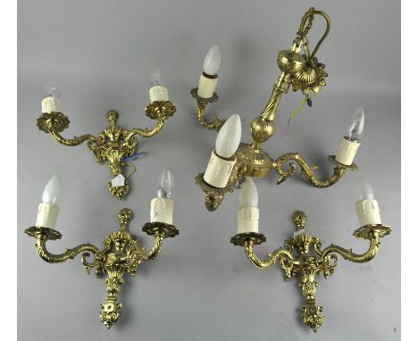 A brass ceiling light and two matching wall lights