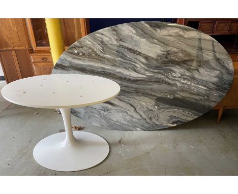 A Knoll studio dining table designed by Eero Saarinen, the oval marble top on a tulip base, 198 cm long x 121 cm wide x 73 cm