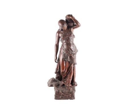 In the manner of Frederick Goldscheider a painted terracotta of a female water carrier on a naturalistic moulded base. 79 cm 