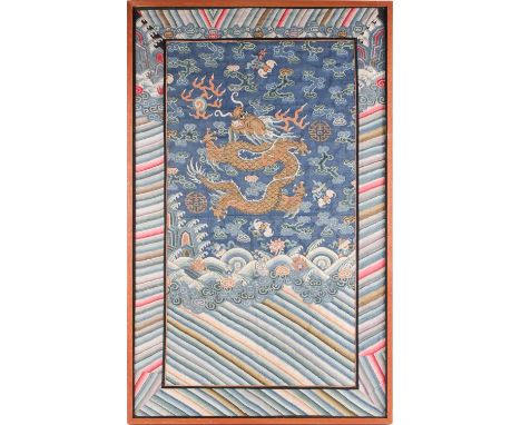 A Chinese kesi embroidered dragon panel, Qing, 19th century, the gilt thread dragon chasing a flaming pearl surrounded by gil