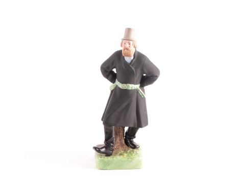 A Russian Gardner (Moscow) biscuit porcelain figure, depicting a dancing bearded peasant, standing with hands on his hips and
