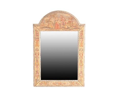 A Charles II style needlework wall mirror, the carved and silvered frame with embroidered scenes of lovers in open landscapes
