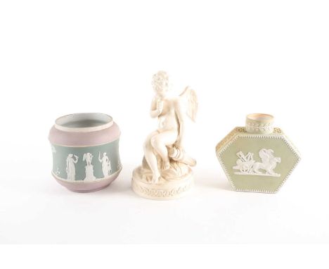 A Wedgwood tricolour jasperware cache pot and hexagonal caddy, 19th century, the cache pot with sprigged classical figures in