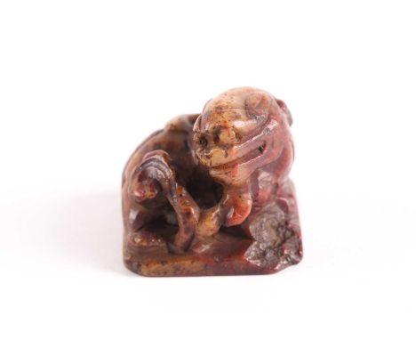 A Chinese carved soapstone Bixie seal, Qing, possibly 18th century, on a square base, the seal formed of four characters, the