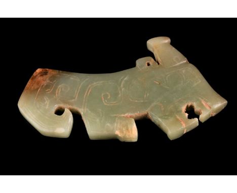 A Chinese archaic beast jade pendant, with incised decoration, the stone a uniform green with a touch of russet at the tail, 