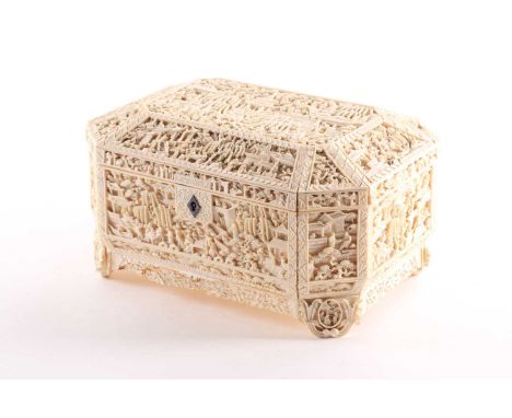 A Chinese Canton ivory sewing box, Qing, mid 19th century, profusely carved throughout with figures, buildings, pine and will