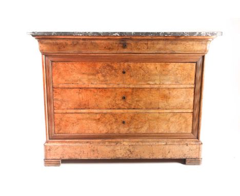 A 19th century French marble-topped burr walnut commode with an ogee moulded frieze drawer with a further three flush fitting