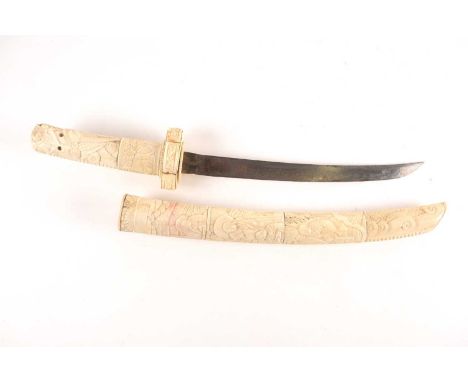 A Japanese Meiji period Wakizashi with bone scabbard grip and tsuba carved with scenes of sages and monks. The hilt in the fo