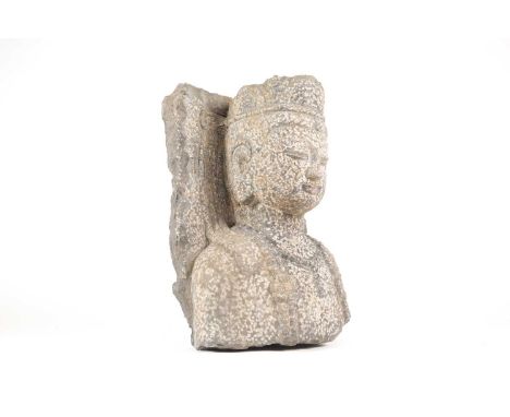 A Chinese carved granite architectural fragment of Guanyin. 46 cm high x 31 cm wide