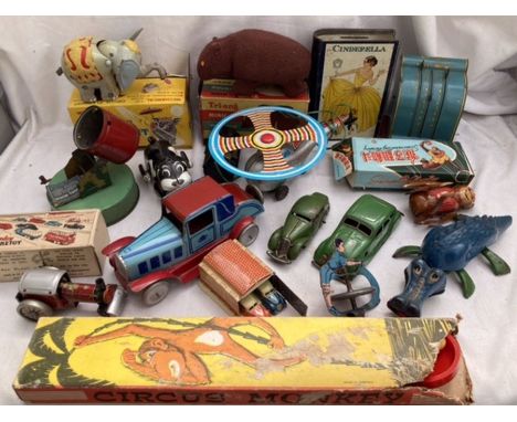 Tinplate: A vintage tinplate collection to include clockwork Triang Bear, Brimtoy Road Roller, C.K. Japan Circus Elephant, Co