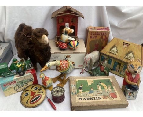 Tinplate: A vintage tinplate collection to include clockwork Fairylite Elephant Boy, Fox Magician, Marklin spinning top set, 