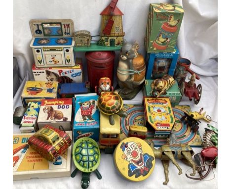 Tinplate: A vintage tinplate toy collection to include German windmill, Marx tank, clockwork camel with rider, Tom and Jerry 