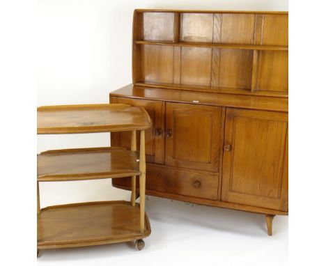 ERCOL OCCASIONAL FURNITURE comprising pale oak sideboard, tea trolley 71cms wide and wall shelf 107cms wide (3)