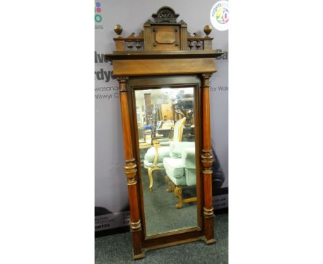 19TH CENTURY WALNUT NARROW OVERMANTEL MIRROR, architectural pediment turned column uprights, 160 x 74cms Condition Report: ar