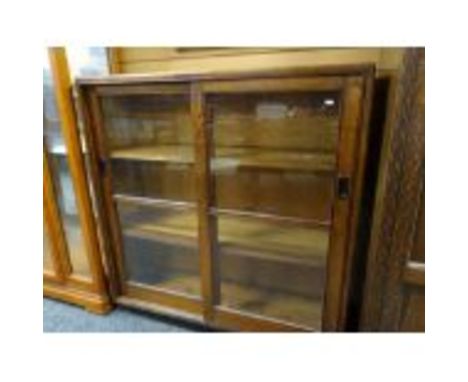 VINTAGE OAK BOOKCASE, glazed sliding doors with flush metal handles, plinth base, 122cms wide