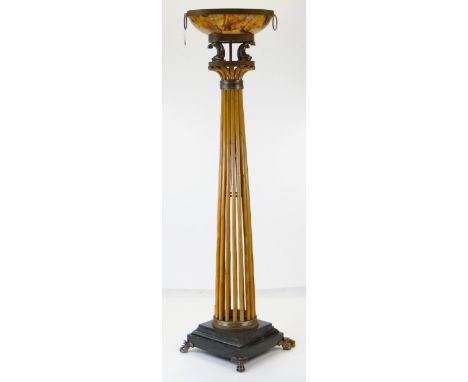STYLISH HARRODS RATTAN & PENSHELL STANDARD UPLIGHT, with dolphin supports on black slate veneered stepped base and metal lion
