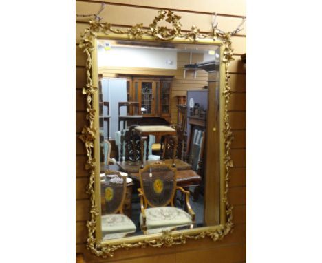 VICTORIAN GILT GESSO RECTANGULAR WALL MIRROR, moulded frame with applied fruiting vine, vine wreath crest, 113 x 78cms Condit