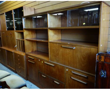 TWO SUITES OF MID-CENTURY STYLE TEAK MODULAR CABINET FURNITUREThere are a few red marks/stains inside one of the cupboards on