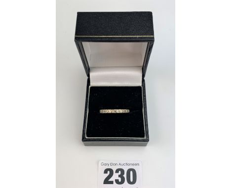 Unmarked white stone eternity ring, size R, w: 2.2 gms