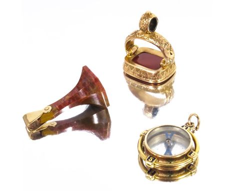 Three 19th century yellow metal and hardstone fobs, including an enamelled compass, carnelian and agate, engraved Though Lost