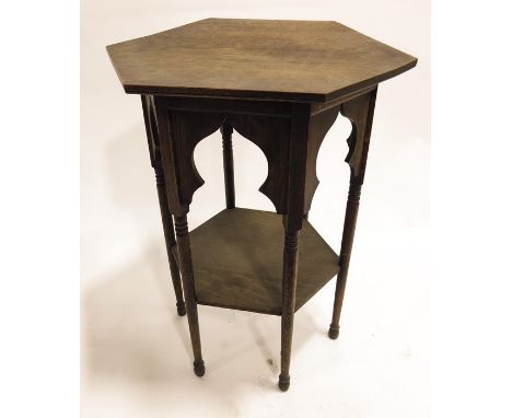 Liberty and Co., an Arts and Crafts Moorish oak occasional table, hexagonal form with onion domed arcading and low shelf, on 