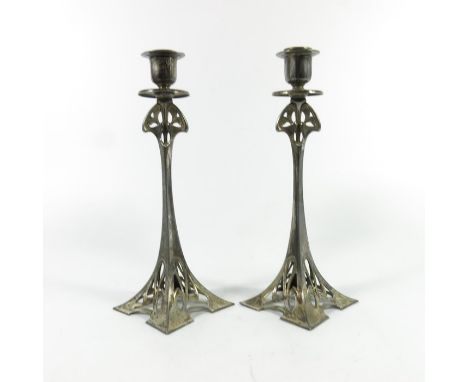 WMF, a pair of Jugendstil silver plated candlesticks, model 92, square section splayed form, reticulated with sinuous tendril