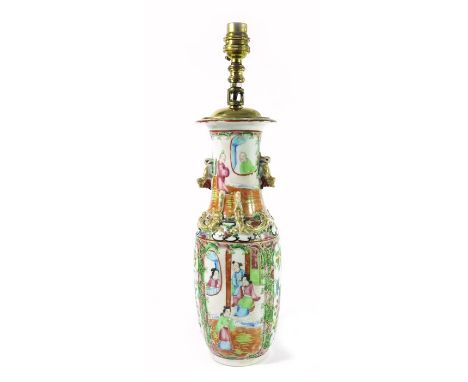 A Chinese famille rose vase, 19th century Cantonese, converted to a lamp, lizard moulded neck and dog handles, painted with a