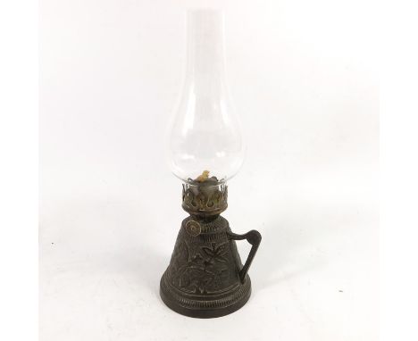 An Aesthetic Movement cast iron chamber oil lamp, conical form, relief moulded with butterflies and wild flowers, Falk's wick