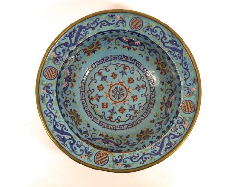 A large Chinese enamelled basin, Qianlong, blue with bat and dragon border, interlocking ruyi head and foliate scroll wreaths