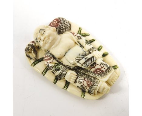 λ A 19th century Japanese ivory netsuke, Meiji, modelled as a sleeping man, 6cm long