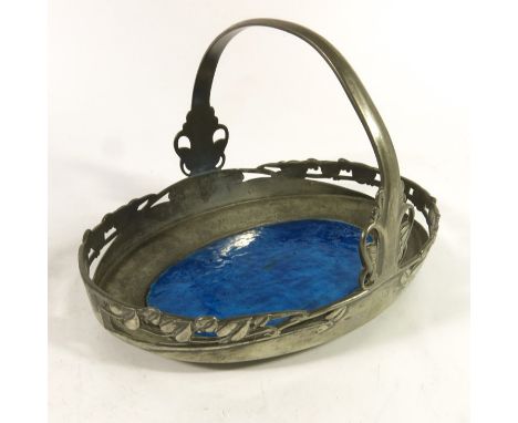 Archibald Knox for Liberty and Co., a Tudric pewter and enamelled cake basket, 0359, the central oval in blue enamel, in a re