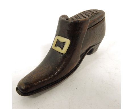 A 19th century carved wood snuff box, in the form of a shoe, carved slide lid with diaper detailing, the buckle inlaid as bon