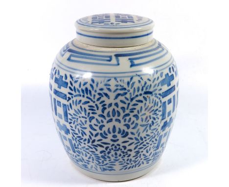 A Chinese blue and white ginger jar, stencilled foliate scroll and geometric block design, 24.5cm high