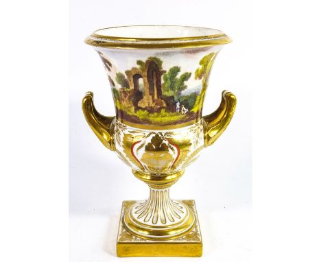 A porcelain pedestal vase, circa 1810, Campana urn form, painted with a romantic landscape with ruins, over a gilt foliate ba