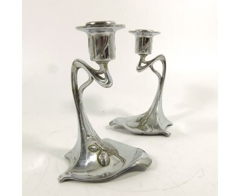 WMF, a pair of Jugendstil plated candlesticks, model 329, open whiplash tendril supports, the bases cast with seeding fern de