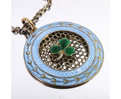 A Norwegian silver gilt and enamelled pendant on chain, the reticulated honeycomb with central green enamel clover leaf, with