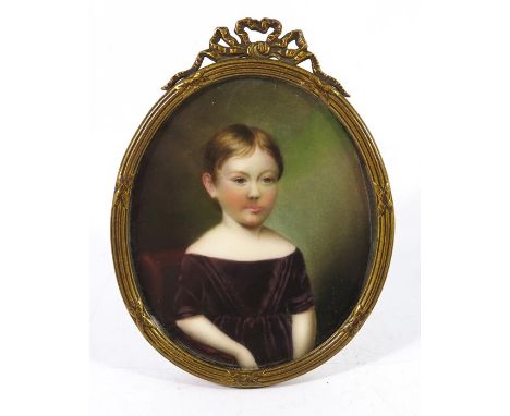 A 19th century portrait miniature on porcelain, depicting a young girl, 8cm x 6.5cm, framed