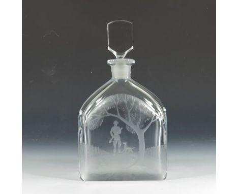Nils Landberg for Orrefors, an engraved glass decanter, circa 1960s, etched with a hunter and dog in open woodland, etched ma