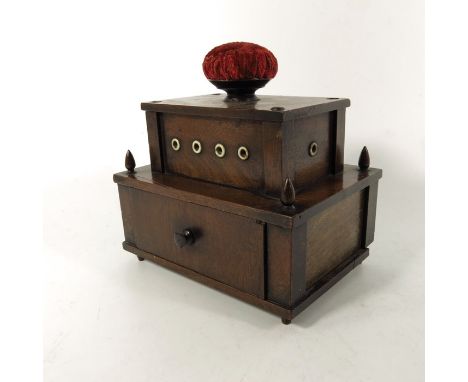A 19th century American two tier mahogany workbox, New York, circa 1875, the lower section with single drawer and pointed fin
