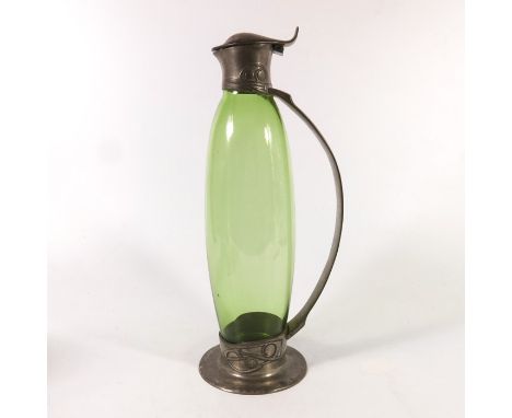 Archibald Knox for Liberty and Co., a Tudric pewter and glass claret jug, 0308, the green glass decanter body probably by Jam