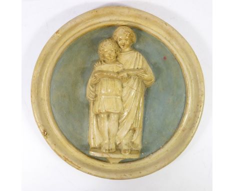 Phoebe Stabler (attributed), a relief moulded plaque of children singing, within a pale blue ground, signed P stabler, 26cm d