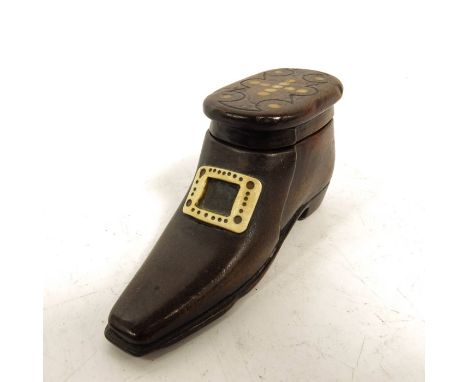 A 19th century carved wood snuff box, in the form of a shoe, the slide lid set with horn roundels, the buckle carved in bone,
