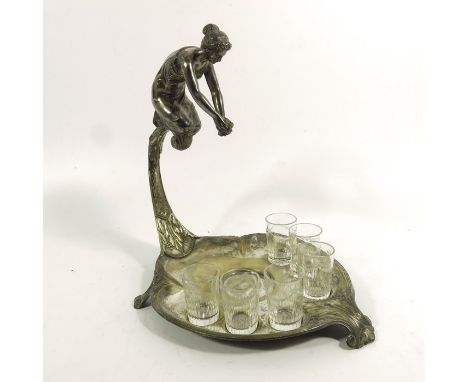 WMF, a Jugendstil silver plated liqueur set, the stand modelled with a woman holding a flower, kneeling on a scroll bracket, 