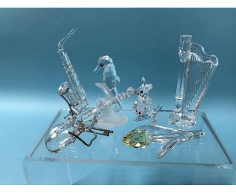 Six boxed Swarovski ornaments to include 'saxophone', 'harp', 'violin', 'seahorse', 'kangaroo' etc.