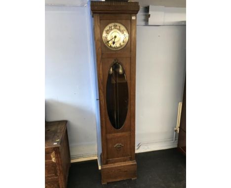 An oak long case clock