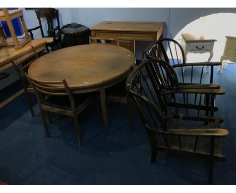 A teak G Plan circular table, chairs and two Ercol chairs