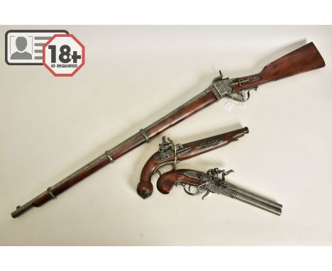THREE WHITE METAL COPIES OF ANTIQUE FIREARMS, the first is a copy of a Miquelet flintlock pistol having lost the end of its t