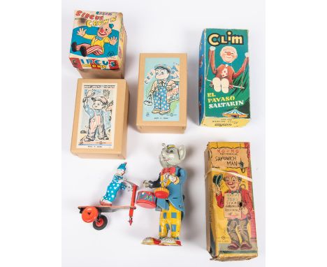 6 Tinplate Toys. Ko-Ko Clockwork Sandwich Man, by TN Japan. Circus Clown, by K Japan. 2x Reproduction: Circus Boy and News-Bo