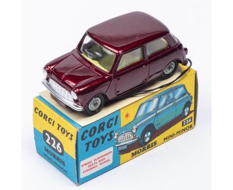 A Corgi Toys Morris Mini-Minor (226). In metallic maroon with lemon interior and detailed cast wheels. Boxed, very minor wear