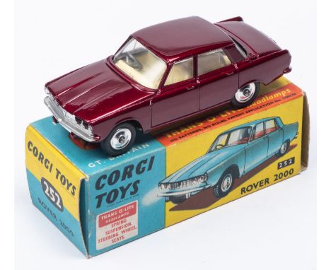 A Corgi Toys Rover 2000 (252) in metallic maroon with cream interior. Boxed, minor wear. Vehicle VGC, minor marking mainly to